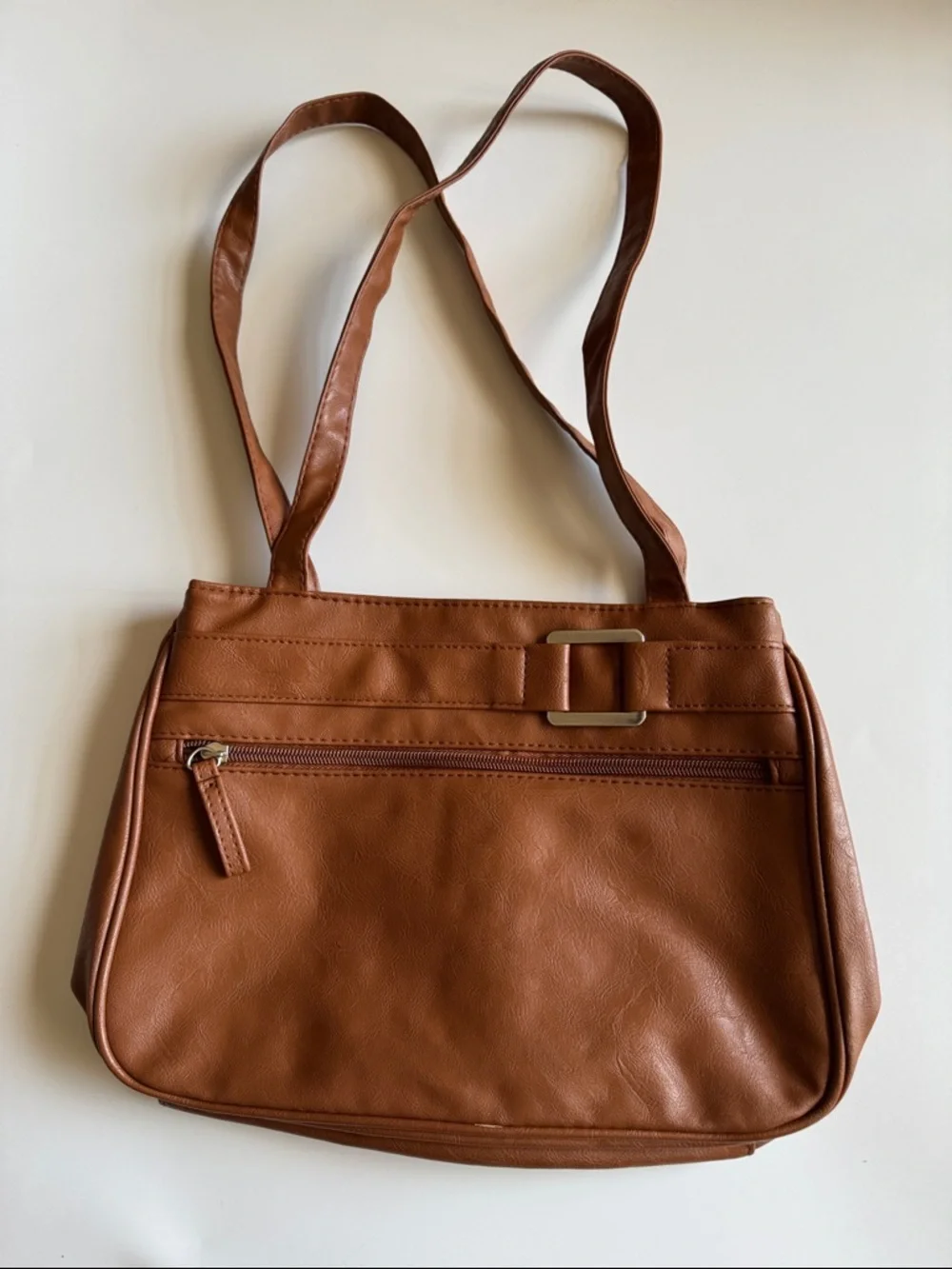 Brown purse with straps. Classic design and lots of organization.